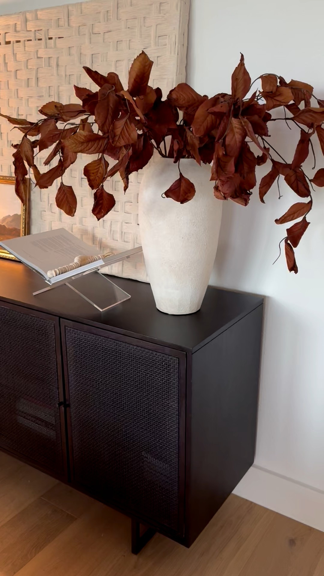 Little touches of fall. Added fall stems + a fall candle + fall art. Mt stems are sold out online but I’ll link some similar ones. 

Brown fall stems, console stying, affordable fall decor, white vase, cozy fall vines, warm and cozy, organic modern, natural elements, realistic fall stems, black console, table lamp, book stand, 

#LTKHome #LTKSeasonal #LTKFindsUnder50