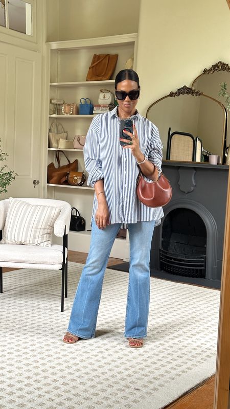 Cloudy day OOTD - these new Madewell flea market flare jeans are amazing! Paired with this striped button down that is such a great staple. 

#LTKover40 #LTKstyletip #LTKxMadewell