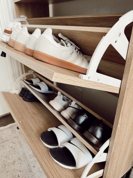 when function meets beauty ✨🤍

I shared a reel on this space not so long ago but this cabinet has been so wonderful in concealing our shoes! It is located in a small entry by our garage door and Shaun’s home office space ☺️

entry details:
+ shoe cabinet: Amazon 
+ planter: Walmart
+ florals: Hobby Lobby
+ candle: Amazon
+ framed art: Amazon
+ hooks: Amazon
+ candle tray: Target

FAQ about the shoe cabinet: Can it store men’s shoes or high heels?
Answer: I cannot fit bigger mens shoes nor high heels unless I take out that middle divider in the shelf that is optional. Do I still love it though? Absolutely! Fits a ton of our boys shoes and mine while concealing them! Shaun usually puts his in his closet anyway too 🫶🏼

Everything here is linked in my bio! Happy Thursday my friends!! 🌻



#LTKstyletip #LTKfindsunder50 #LTKhome