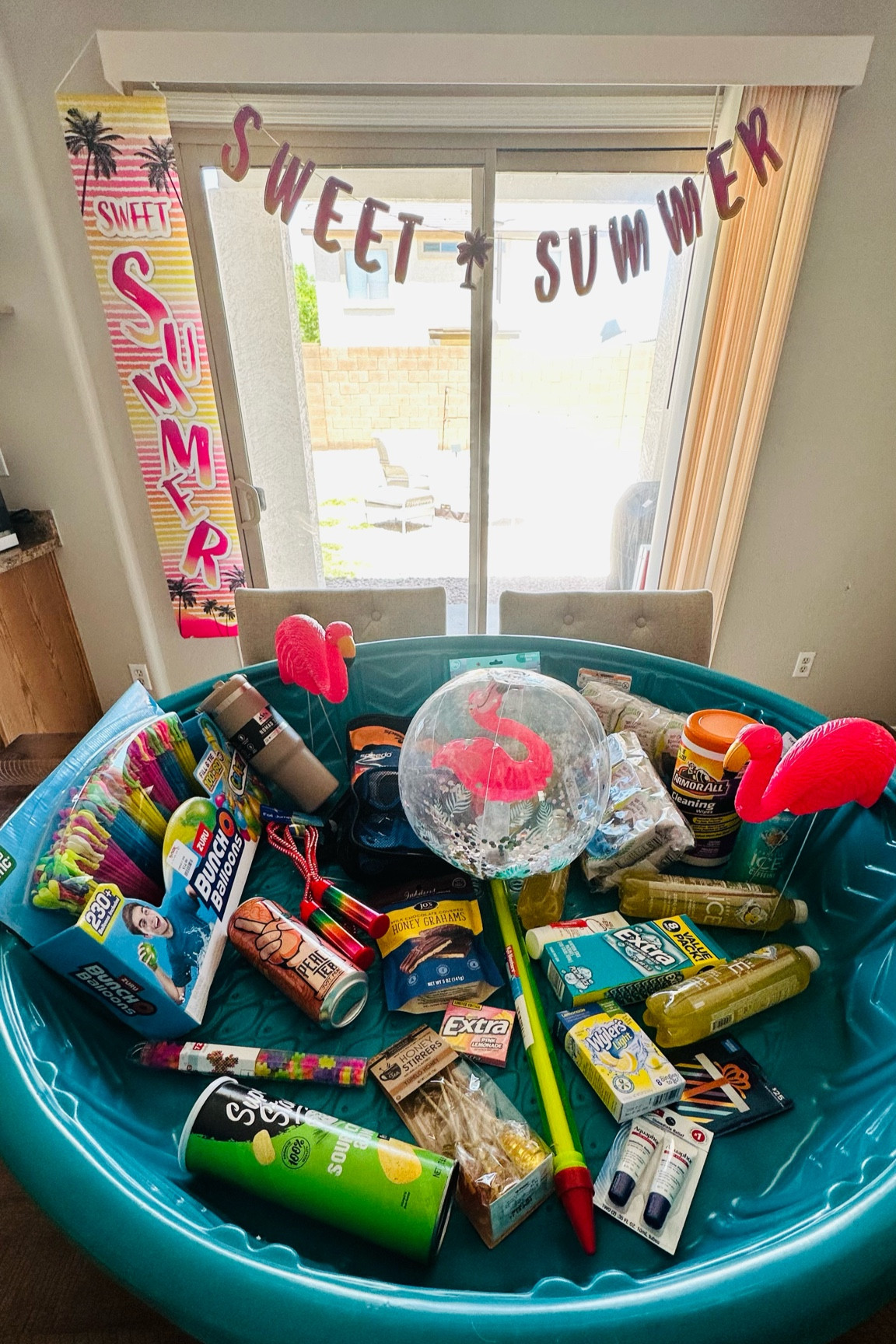 Almost every year when the kids get out of school I get them some sort of celebratory gift to mark the end of school and the beginning of summer!

This year we went with a kiddy pool  (n sale for $9 btw) filled with all things summer: beach ball, water guns, water balloons, sparkling ice drinks, peach tea, pink lemonade gum, polar ice gum, flamingos, Pringle’s, drink mix, jump rope, chocolate covered graham crackers for s’more’s, car cleaning supplies for my new driver, hashtag toys, insulated tumbler cup that fits in a cup holder, scuba diving set, an American Express gift card, honey sticks for tea, teriyaki seaweed, summer themed reusable ice cubes, sun bum sunscreen,  and Aquafor lip repair.

I snagged some of the items from Target, Tj Maxx, and the Dollar tree, but linked what I could from Target to make shopping that much easier for you! 

Happy summer 😘🦩

#LTKFindsUnder50 #LTKGiftGuide #LTKSeasonal