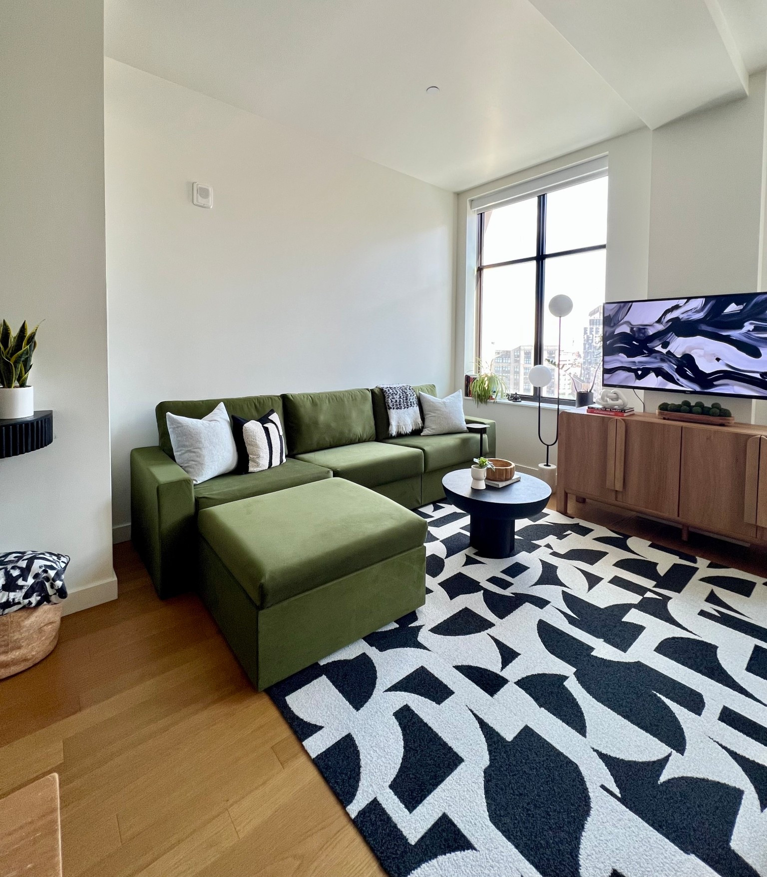 The best living room view!

A backdrop of black and white and a bold green sofa!

Chef’s kiss!

#livingroomdecor #homestyle #boldstyle #cityliving 

#LTKSaleAlert #LTKHome #LTKmorningroutine