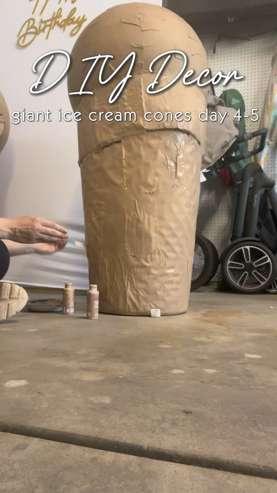 Supply list - 
2 cone shaped tall laundry baskets. I found these at Target for $7 a piece.
2 medium sized exercise balls (21-25 inch fits well in these baskets). These were $5 a piece balls from Five Below. 
Cardboard cut into strips (I disassembled a medium sized Amazon box and used almost the entire box) I cut along the seams and used the flaps for the rims. 
Hot glue sticks and glue gun
A box cutter or exacto knife
Painters tape
Scissors
Brown butcher block paper 
Elmer’s glue (I bought a large size jug) and am using a 2 parts glue to one part water ratio to create a paste.
Medium and large paint brushes (found for
$2 at 5 below) 
Acrylic paint for both the cone and whatever colors you choose for the icecream (found a full paint set at 5 Below) 
Gaps and Cracks foam spray (bought two cans for around $6 a piece) you can purchase at Lowe’s, Home Depot, or home improvement store.
2 small plastic red balls for a cherry on top of the cone (I’m stealing two from Isaac’s ball pit!) 
A container of Crayola quick dry clay for the sprinkles (found at 5 Below for $5, but Target also carries it).

I use a 2 to 1 Elmer’s glue to water ratio and cut out brown butcher block paper (or craft paper) to  paper-mache the paper onto both the laundry basket, cardboard, and exercise ball. I used a medium sized paint brush. 

#LTKKids #LTKParties #LTKHome