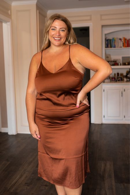 Fall dress from Amazon — The Drop Women's Ana Silky V-Neck Midi Slip Dress. There are lots of things I love about this silk slip dress, but the thing I don't like outweighs the rest. The bra situation is tough... I would have to use boob tape to make it work. I tried it with strapless bra options and they all poked out of the dress. But if you're not as busty and can go bra-less, or you are okay spending a little extra to use tape when you wear it, this is stunning. IT hits me mid shin and the slits start mid thigh on me. It has adjustable straps and a gorgeous neckline. I sized up to XXL and I'm glad I did, it fits snug. This dress would also look cute layered with sweaters over it for extending the cost per wear! This silk slip dress comes in 21 different colors and sizes XXS-5X. I'm wearing the Tortoise Shell color in size XXL. Shop this $49 dress at Amazon.

#LTKSeasonal #LTKunder50