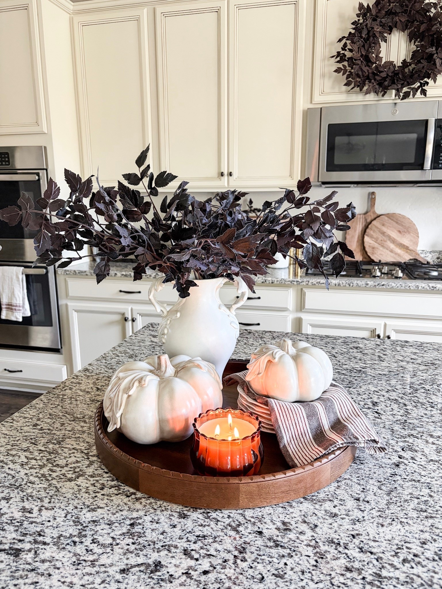 FALL tray styling!

I have been enjoying starting to bring fall into my home. Styling a tray on my kitchen island is always a fun place to start!  I love the contrast of these deep plum stems styled with this beautiful botanical vase and pumpkins. Such a simple way to elevate the look of your kitchen this season. 
I used 3 of the plum stems in the botanical vase on the tray. 

#falldecor #kitchendecor #kitchenstyling #homedecor #stylewithme #seasonaldecor #decorating

#LTKHome #LTKSeasonal