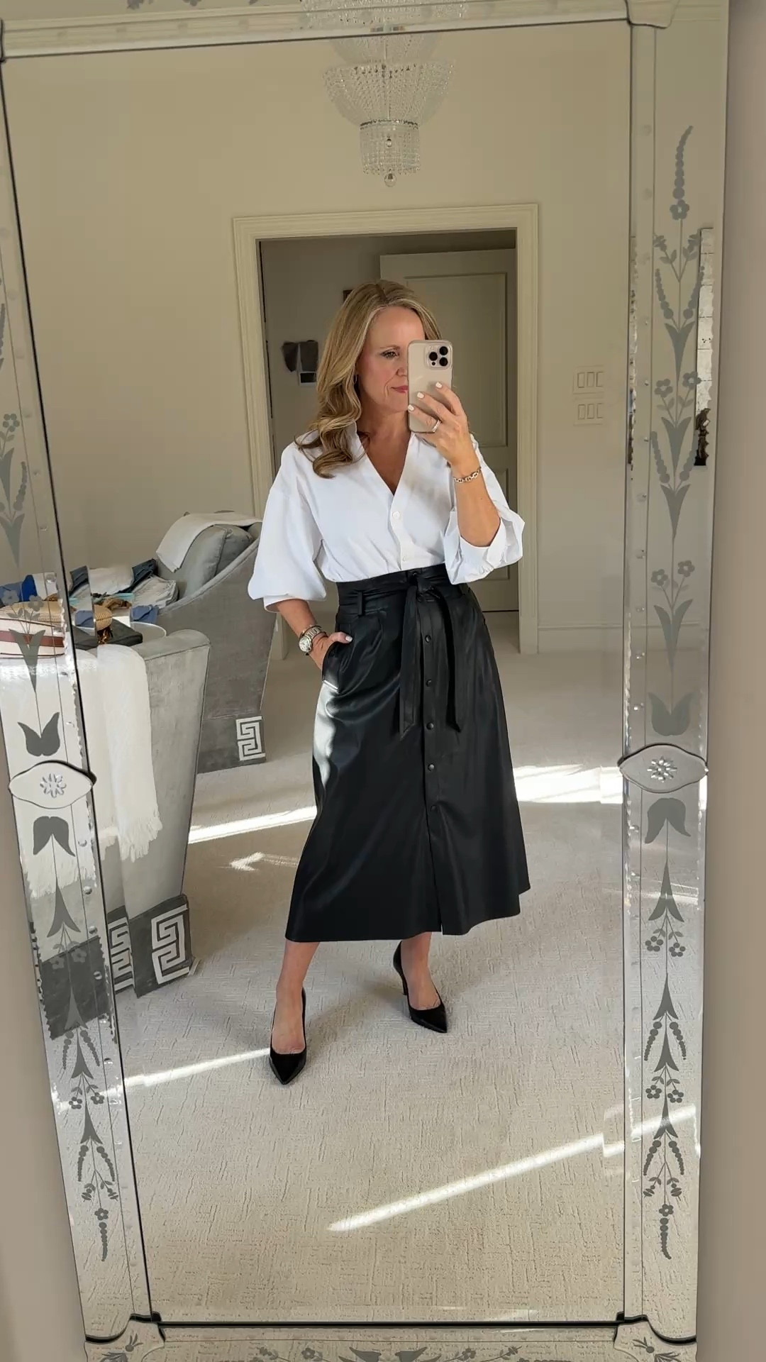 A white shirt is a must have closet and wardrobe staple. This elegant white blouse from Brochu Walker is beautiful and so versatile! I’m wearing this to a fundraiser, kickoff luncheon, and meeting   I have paired it with a faux leather skirt with self belt both fit true to size.
Paired with black Stewart Weitzman power pumps
 

#LTKOver40 #LTKWatchNow #LTKStyleTip