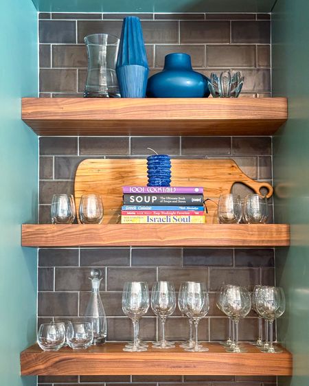 Open shelves are so great for both form and function, depending on your needs and the available space. Sometimes it's just pretty, but usually we need to incorporate things that are used as well - especially in a kitchen or bar area!

