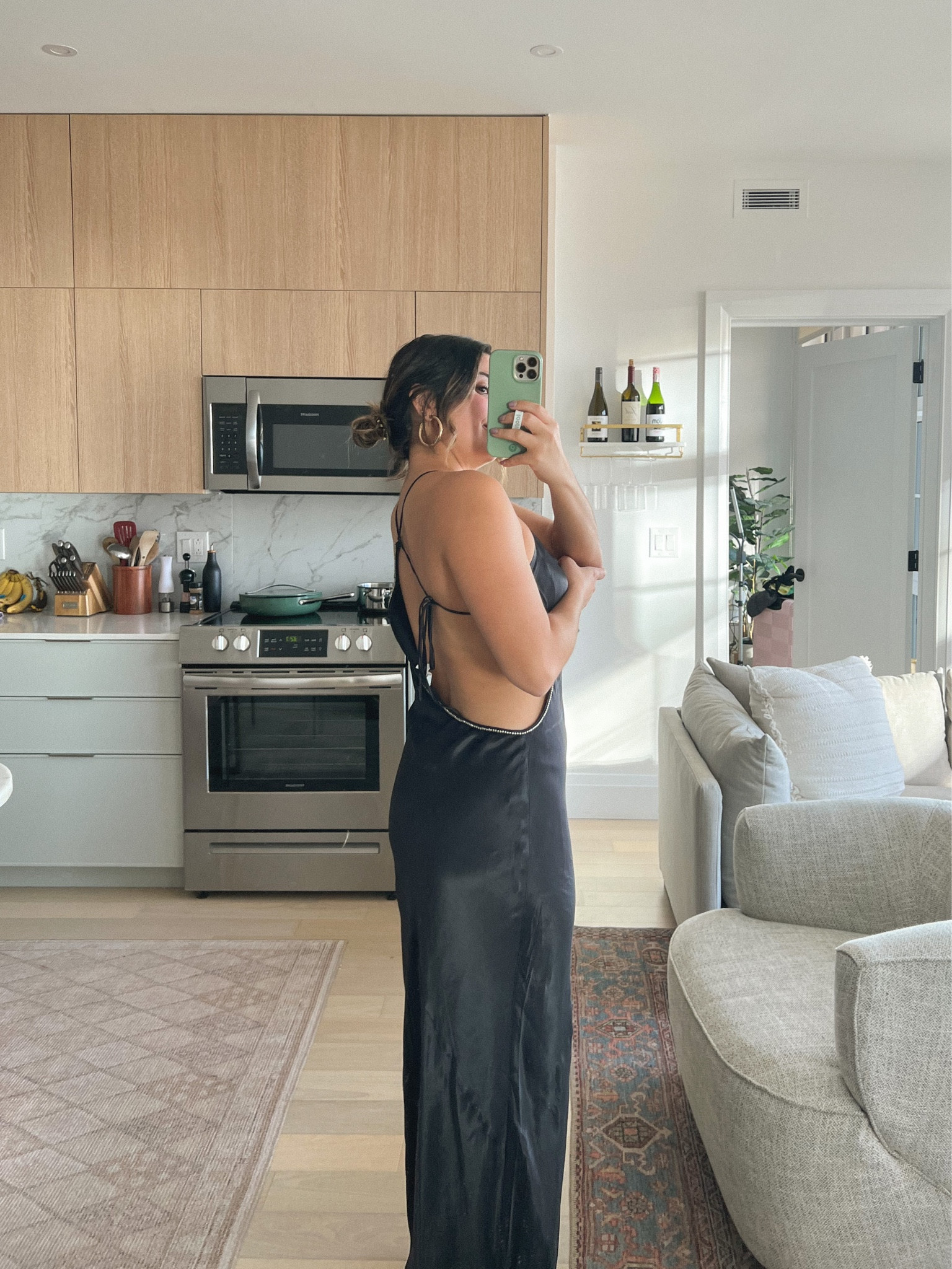 Black maxi wedding guest dresses from revolve. The satin is beautiful & I love how it isn’t skin tight! Super dainty and pretty rhinestone back. True to size, wearing a medium. 

#LTKFind #LTKSeasonal #LTKwedding