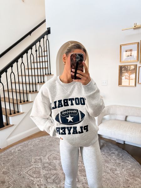 FOOTBALL PLAYER 🏈 Graphic sweatshirt. 

Always ordering something cozy 💕 

This little set is so cute! Wearing the sweatshirt in a small and I recommend sizing up in the pants because they are a bit on the sheer side. 🫣 I sized up from a 0 to a 4!

#LTKSeasonal #LTKstyletip #LTKfindsunder100
