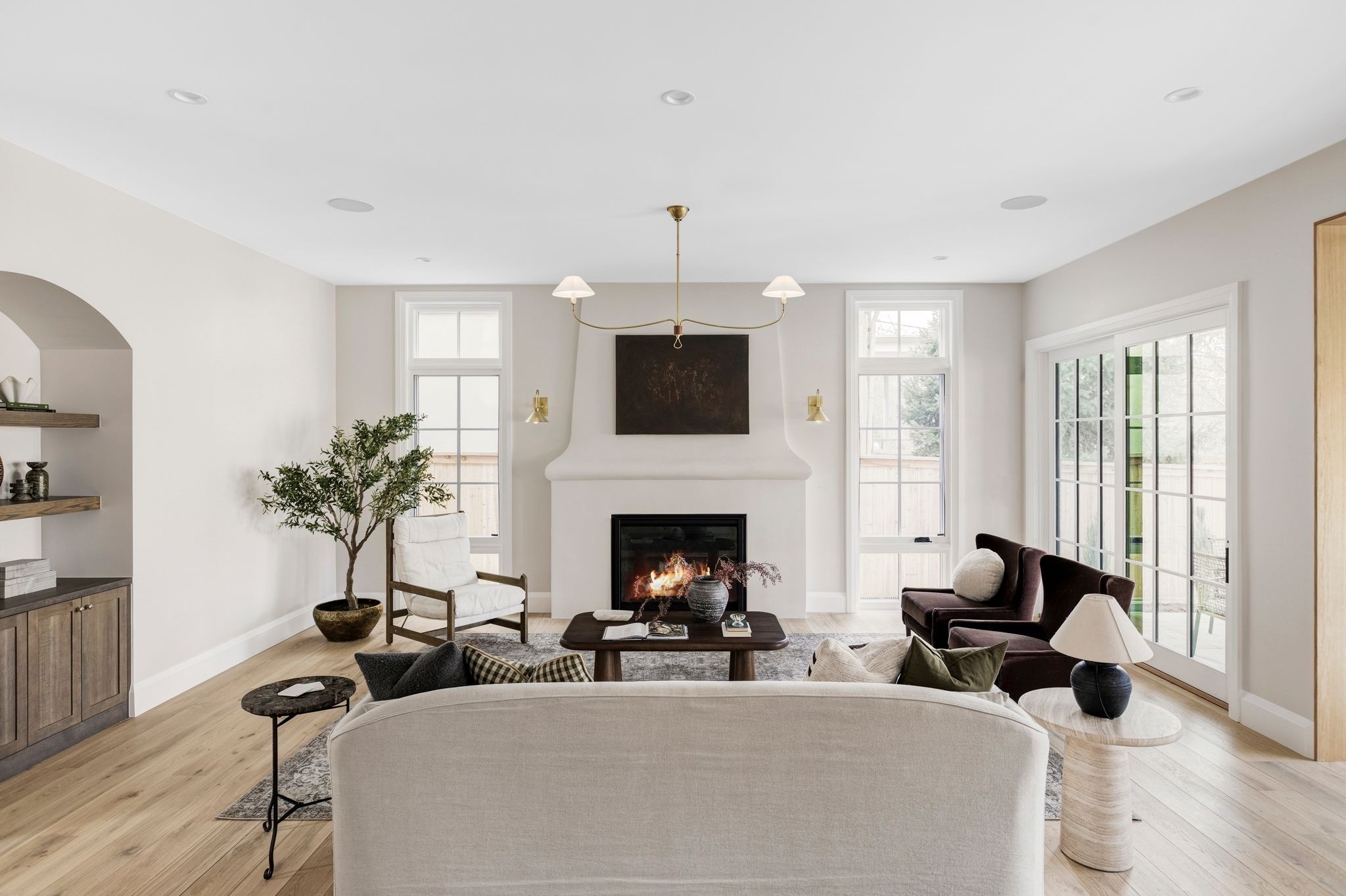 Rich brown wingback chairs, a vintage-inspired sofa, antique rug and stone side tables come together to create a living room that feels timeless. 

Vintage, McGee and co, living room rug, neutral rug, velvet, side table, coffee table

#LTKHome