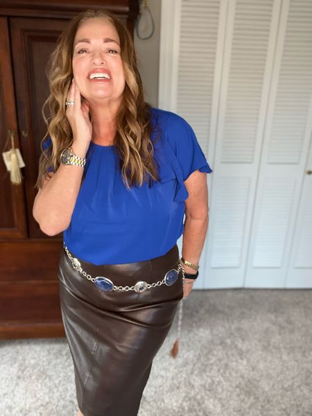 Business casual with a flair.. Royal Blue is the most universally flattering color on everyone. This pleated neckline blouse is perfect for your work style. A coffee colored faux leather skirt and western conch chain belt add some fun unexpected pairing.

#LTKunder50 #LTKSeasonal #LTKstyletip