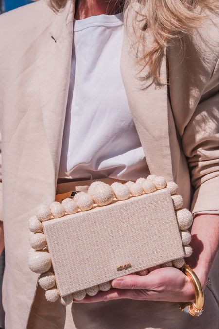 This Cult Gaia clutch is one of my favorite summer handbags. I love its unique design. It has the perfect amount of room for the essentials. 

~Erin xo 

#LTKSeasonal #LTKparties #LTKitbag