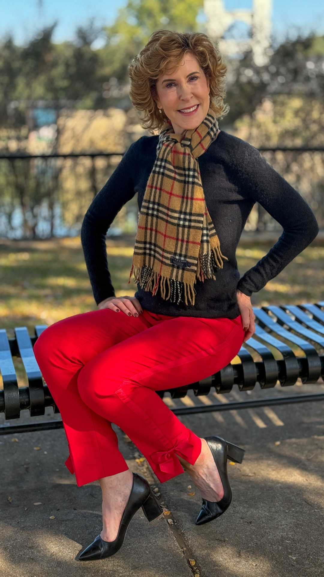 This timeless holidaThis timeless holiday-ready look pairs a classic black cashmere sweater with vibrant red satin-finish pants that feature adorable bow accents at the hem for a feminine touch. A chic designer cashmere scarf adds iconic style and warmth, while sleek black block-heel pumps complete the polished, festive vibe. This classic luxe look is perfect for seasonal outings and celebrations!

#LTKOver40 #LTKHoliday #LTKSaleAlert