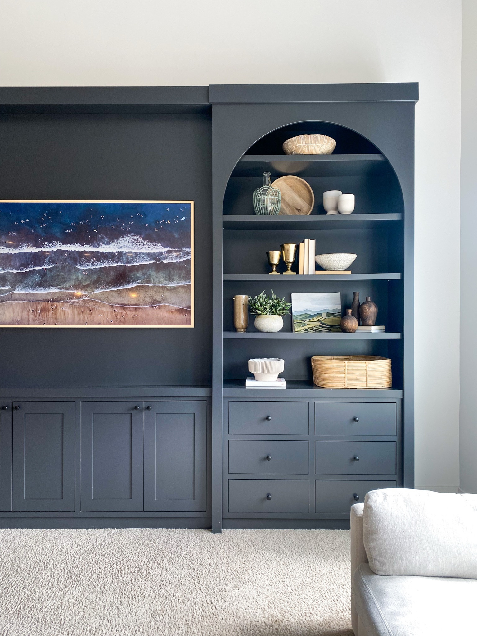 Love dark built-ins but want the room to feel warm? Notice the lighter pieces and natural textures on these shelves 🤎 Adam built this client’s cabinetry. For your own take on the look, I’ve tagged a decorative vase, moss bowl filler and a floor lamp I’d consider beside the seating. These are styling suggestions, not the exact accessories pictured. Check dimensions for your shelves and floor space. Shop the tagged ideas below