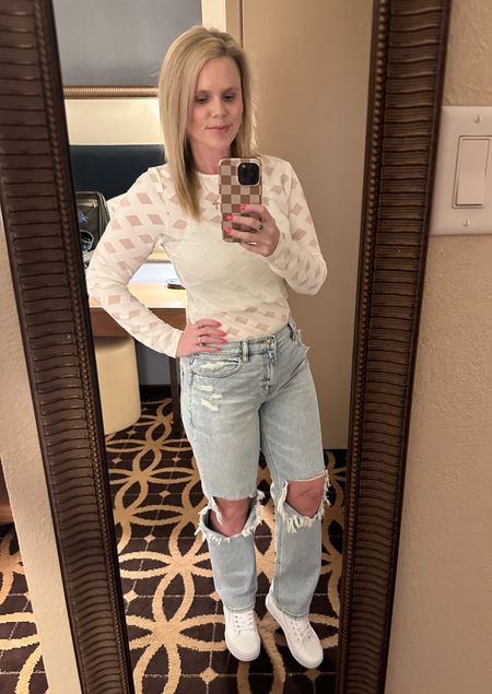 American Eagle jeans are on sale right now. I love these jeans, paired with the high top white vans. These are also perfect transition pieces for spring. The shirt is see-through, but would be perfect with a cute bra to match underneath.. this would be the perfect date night outfit. 

#LTKMostLoved #LTKsalealert #LTKmidsize
