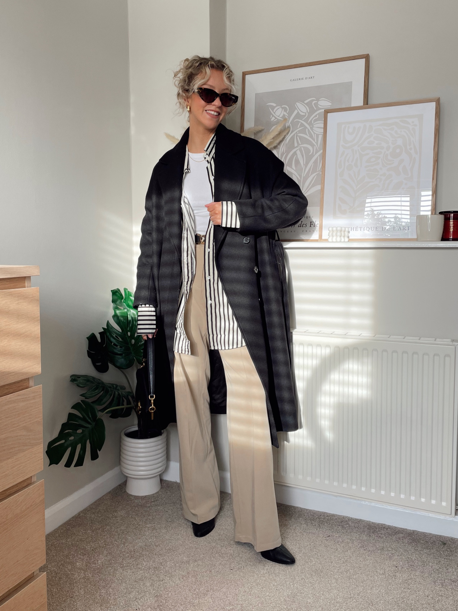 Winter workwear outfit

Black wrap tie coat - Zara (linked similar) 
White tank top - in the style
Black and white striped shirt - H&M (old)
High waisted wide leg beige trousers (old motel rocks)
Black ankle heel boots - old mango
Black shoulder bag - coach tabby 26
Tortoishell sunglasses - quay 

#LTKstyletip #LTKworkwear #LTKSeasonal