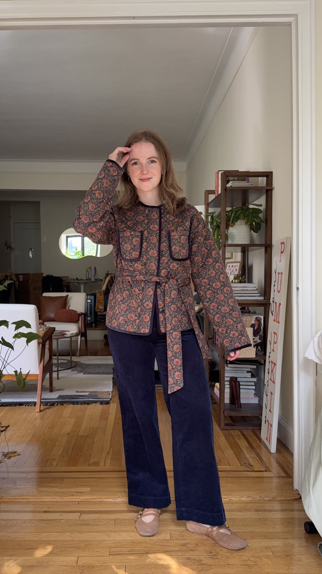 The quilted jacket of my DREAMS! So soft, button back to attach belt and keep it from slipping. Hidden button holes in the from and beautiful velvet trim. Wearing xs. Pants are 0 petite fit true to size