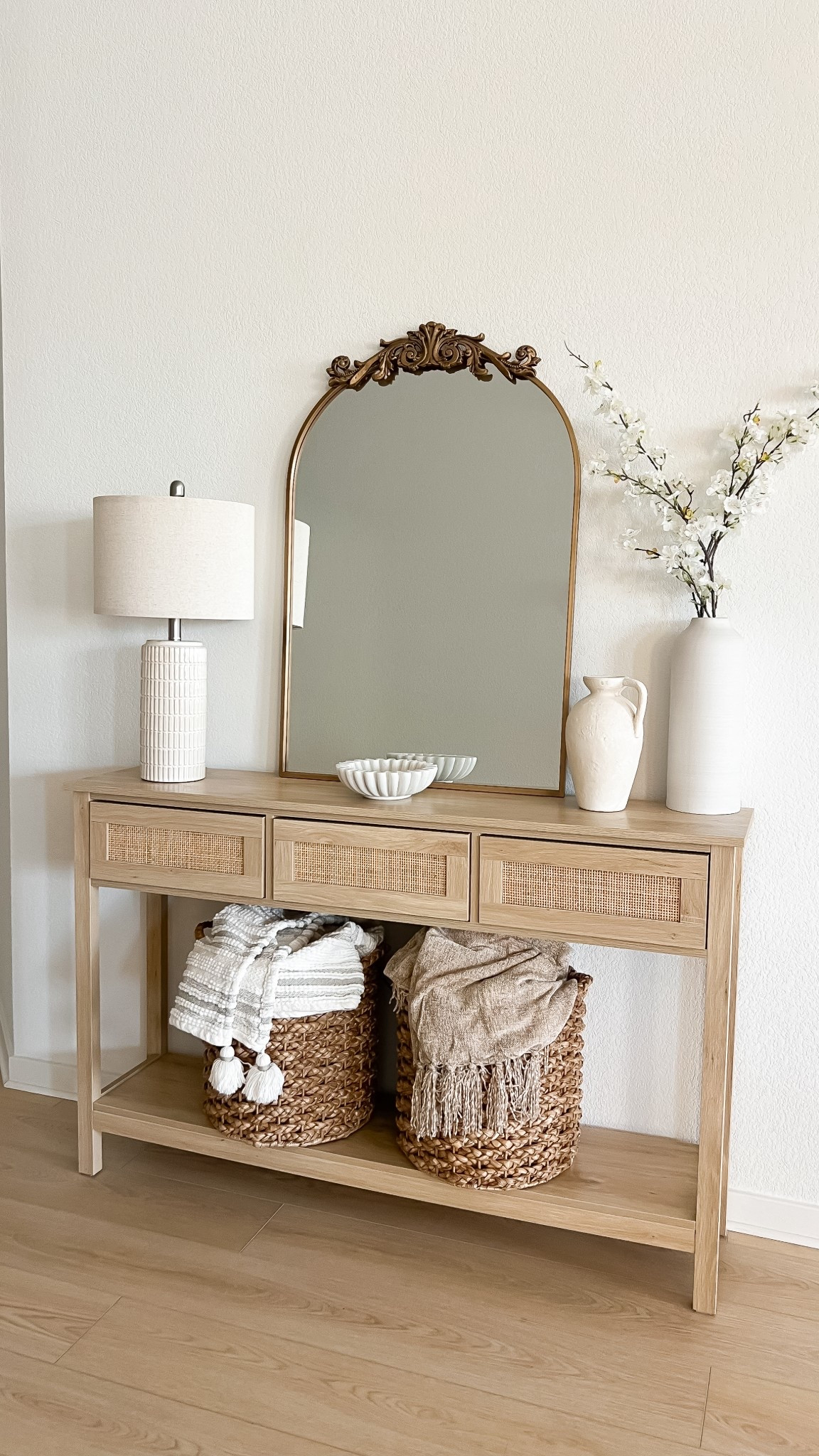 Spring console table styling, spring console table decor, spring home decor, spring decorating ideas for entryway, Amazon spring decor, entryway console table, entryway table decor, entryway decor, entryway table amazon, Amazon home decor, Amazon decor, neutral home decor, neutral decor, neutral style, entryway mirror, anthropologie mirror dupe, primrose mirror dupe, faux cherry blossoms, baskets, throw blankets, neutral vase, decorative vases, neutral table lamp, table lamp living room, table decor, living room decor #LTKStyleTip

#LTKFindsUnder50 #LTKHome #LTKFindsUnder100