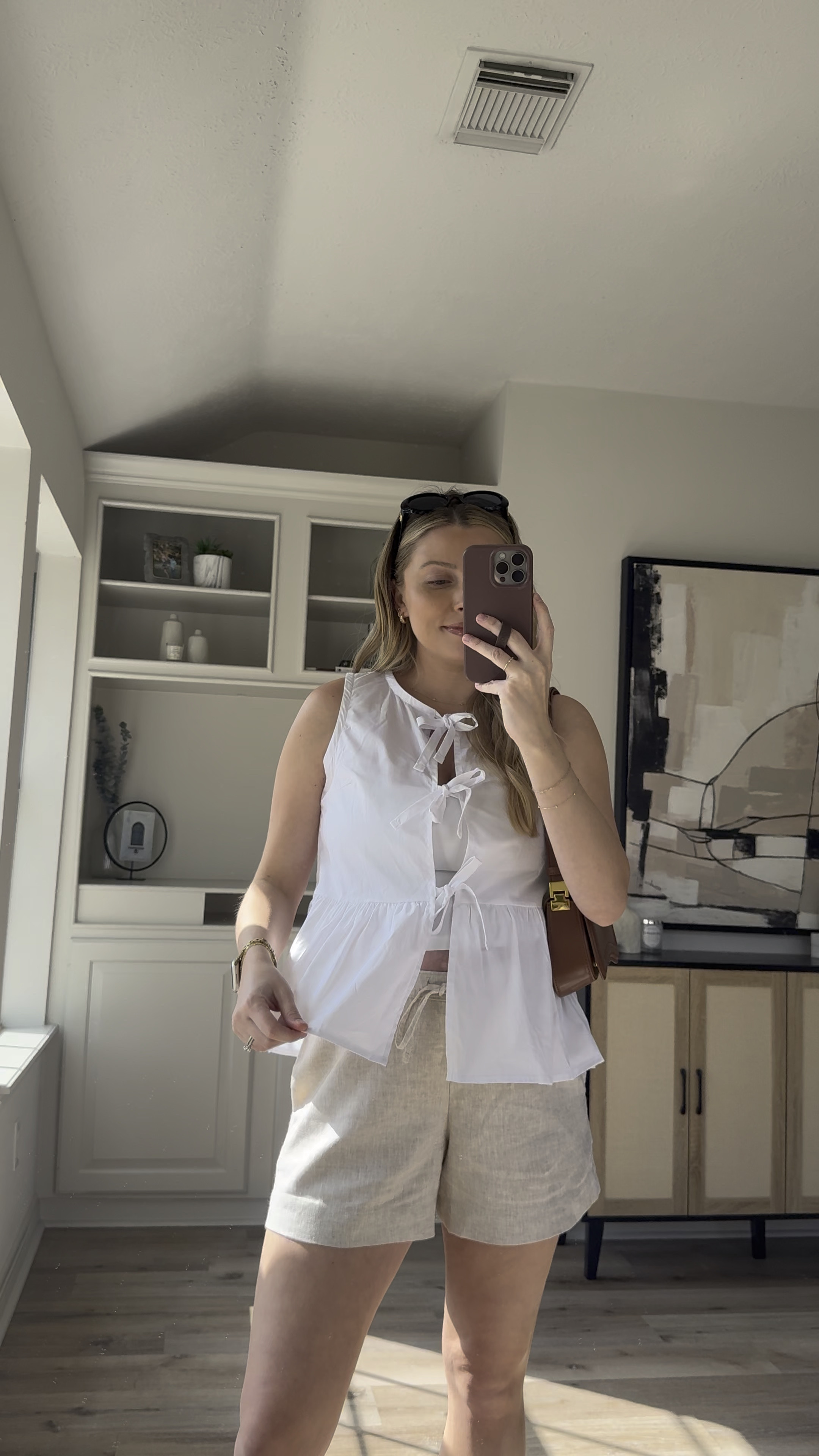 Linen shorts spring outfit | grabbed this top in white after wearing the black top all spring and summer last year! Wearing size M in the top and shorts. 

#LTKSeasonal #LTKBump #LTKStyleTip