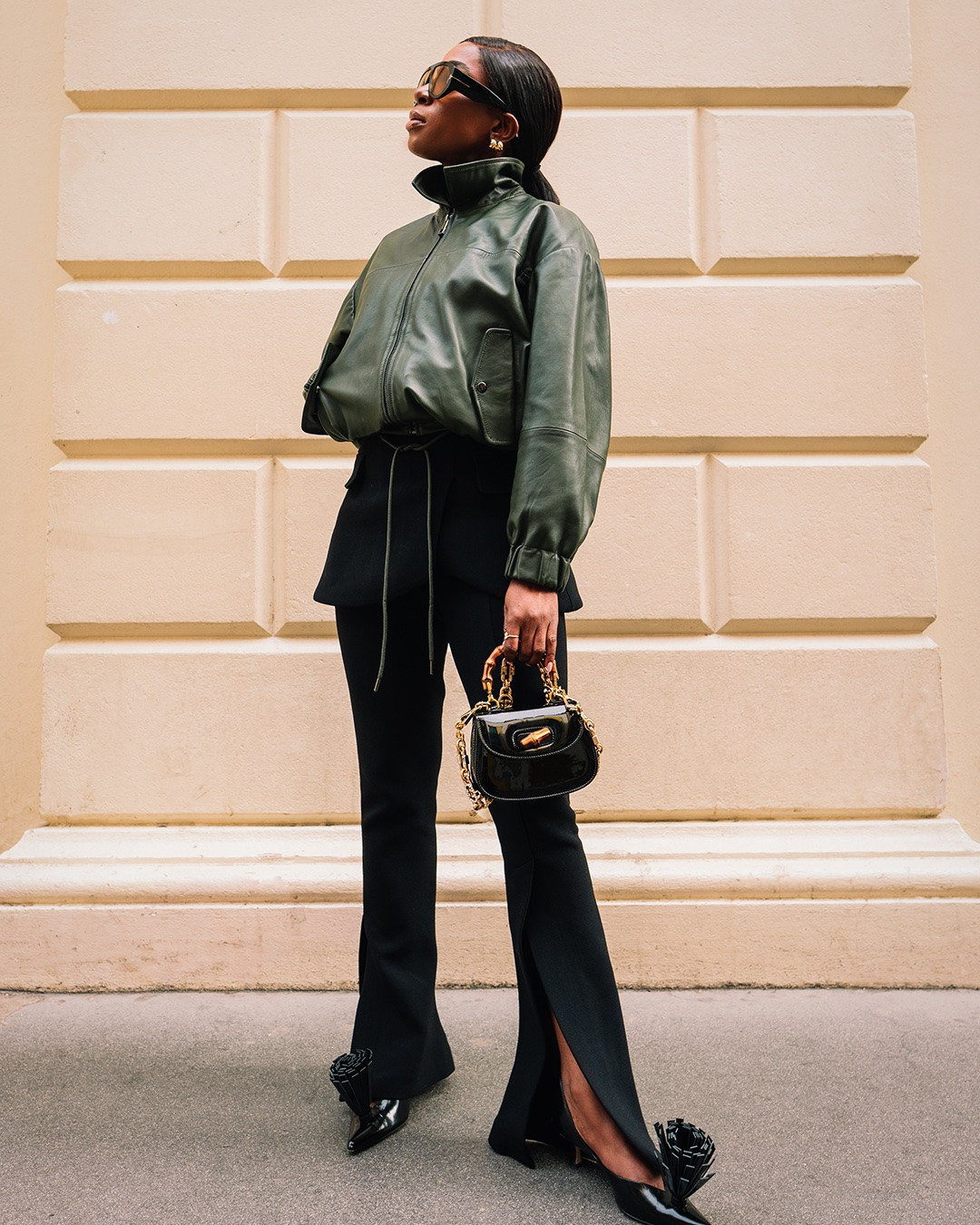 Olive Tones & Sharp Lines

An elevated mix of olive green and black featuring a leather bomber, sculpted peplum detailing and split-hem trousers. Finished with statement heels and gold accents for a polished city look.

olive green outfit, leather bomber jacket, black trousers, split hem pants, peplum detail, statement heels, luxury style, elevated basics, chic outfit, monochrome dressing, black and olive, city style, fashion week outfit, designer accessories, gold jewelry, sophisticated style, street style, modern elegance, LTK fashion, outfit inspiration

#LTKsummer #LTKstyletip #LTKtravel