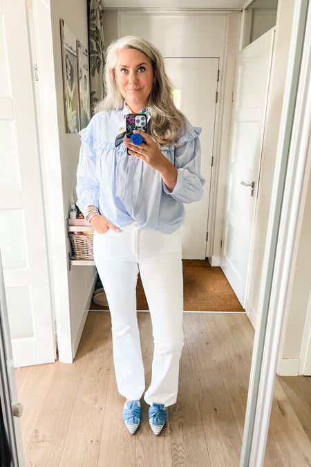 Ootd - Monday. A light blue blouse from a local boutique paired with a satin scarf and white flared jeans (Zara). Blue and white striped Vivaia slides. 



#LTKmidsize #LTKeurope #LTKstyletip