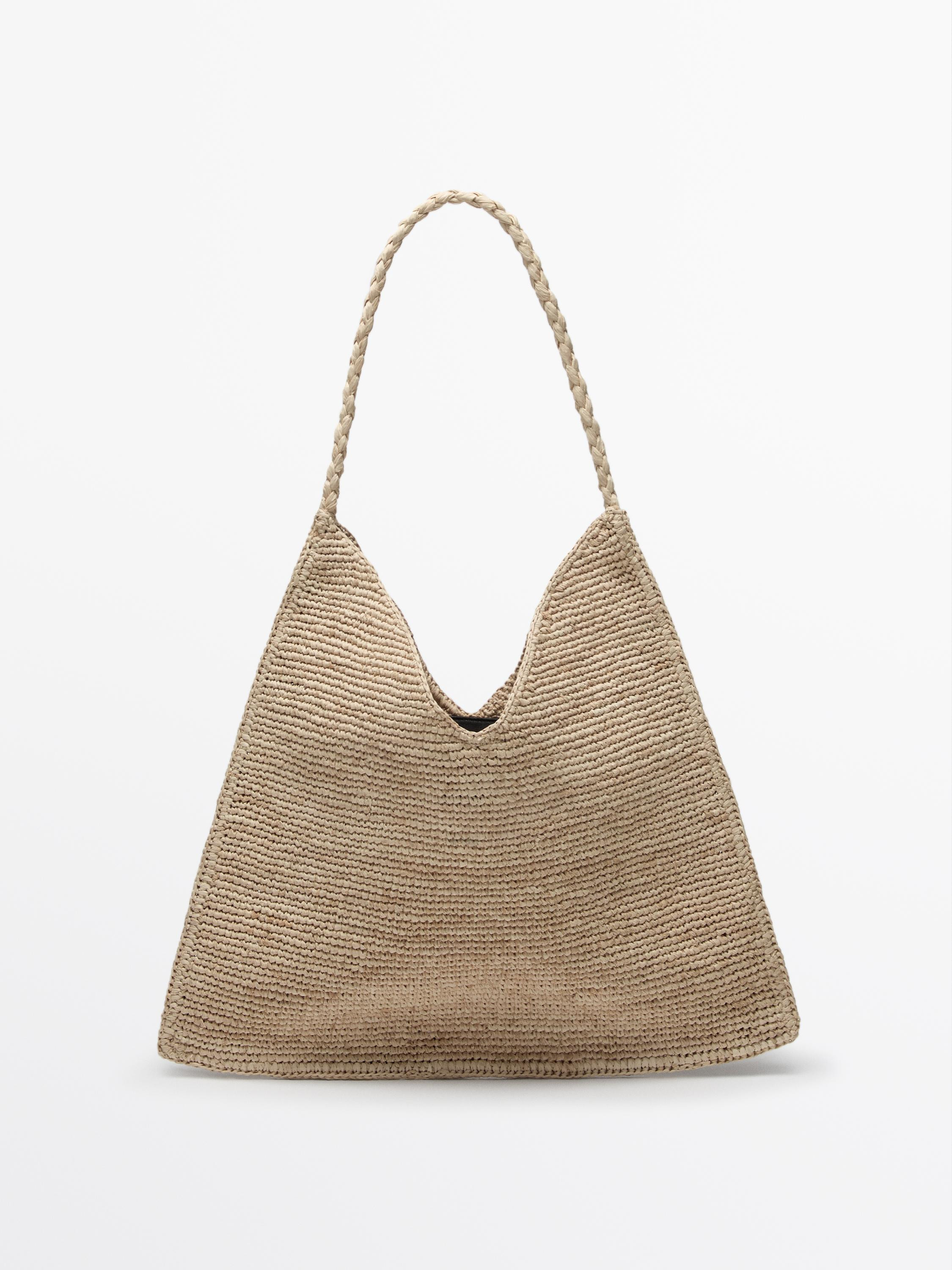 Natural raffia bag. A handle/shoulder strap. Magnetic snap-button fastening. Handle. An inside po... | Massimo Dutti UK