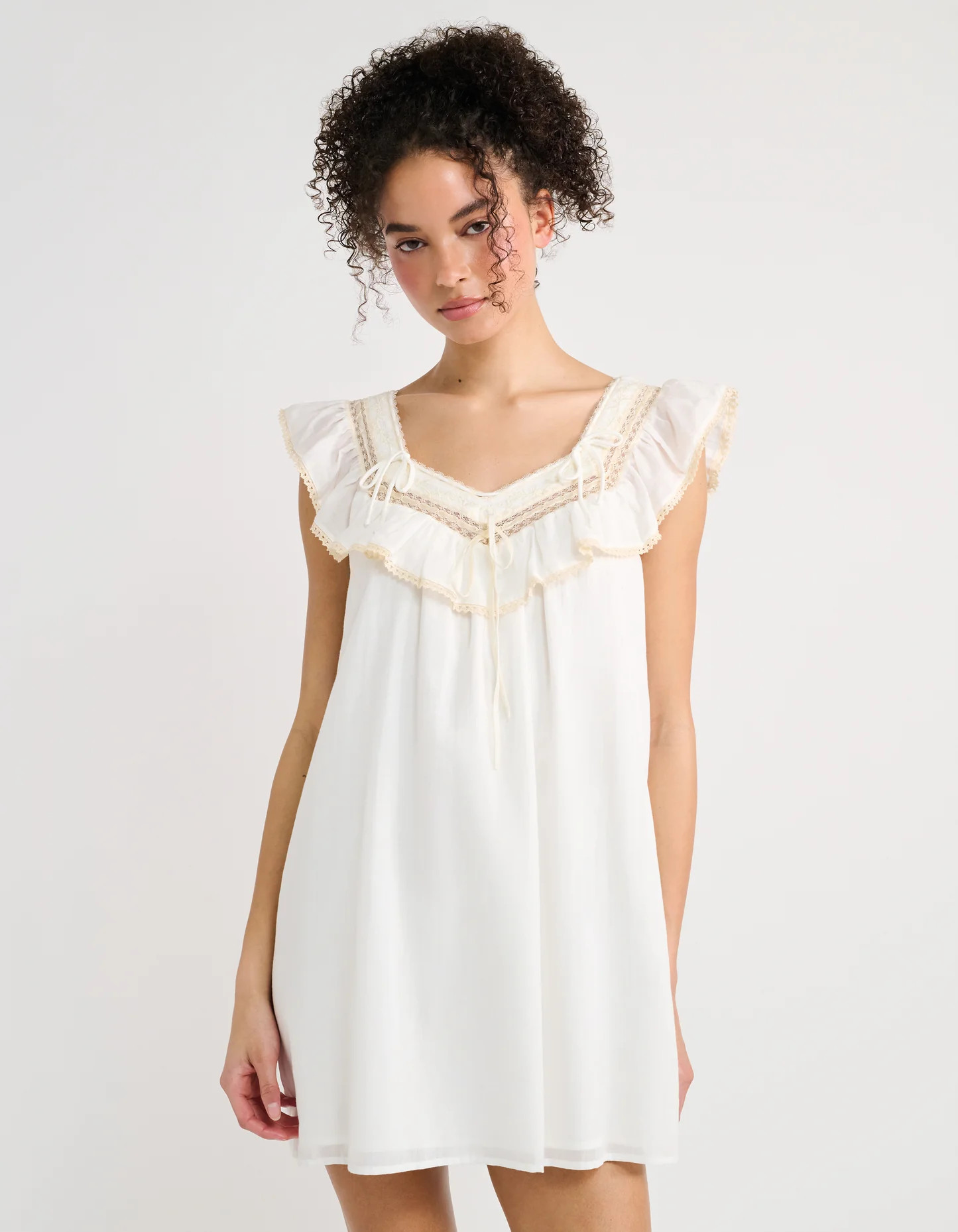 Teacup Cotton Babydoll Mini Dress in White | Shop Rumored | Rumored