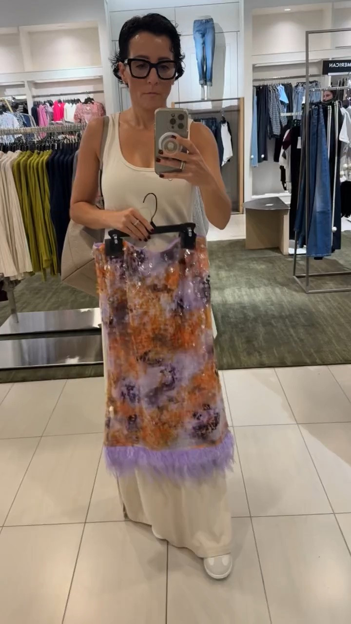A statement skirt like this is where I would let the texture and color lead the entire outfit. The mix of lavender and warm fall tones is beautiful, and the feathered hem gives it that unexpected detail that makes it feel special. Keep the top and accessories simple and let the skirt be the conversation piece.

statement skirt, embellished skirt, feather trim skirt, fall event outfit, special occasion style, fall color palette, statement fashion, women over 50 style, elevated style, fall outfit ideas, event dressing, stylewitheugenia

#LTKootd #LTKSeasonal #LTKOver40