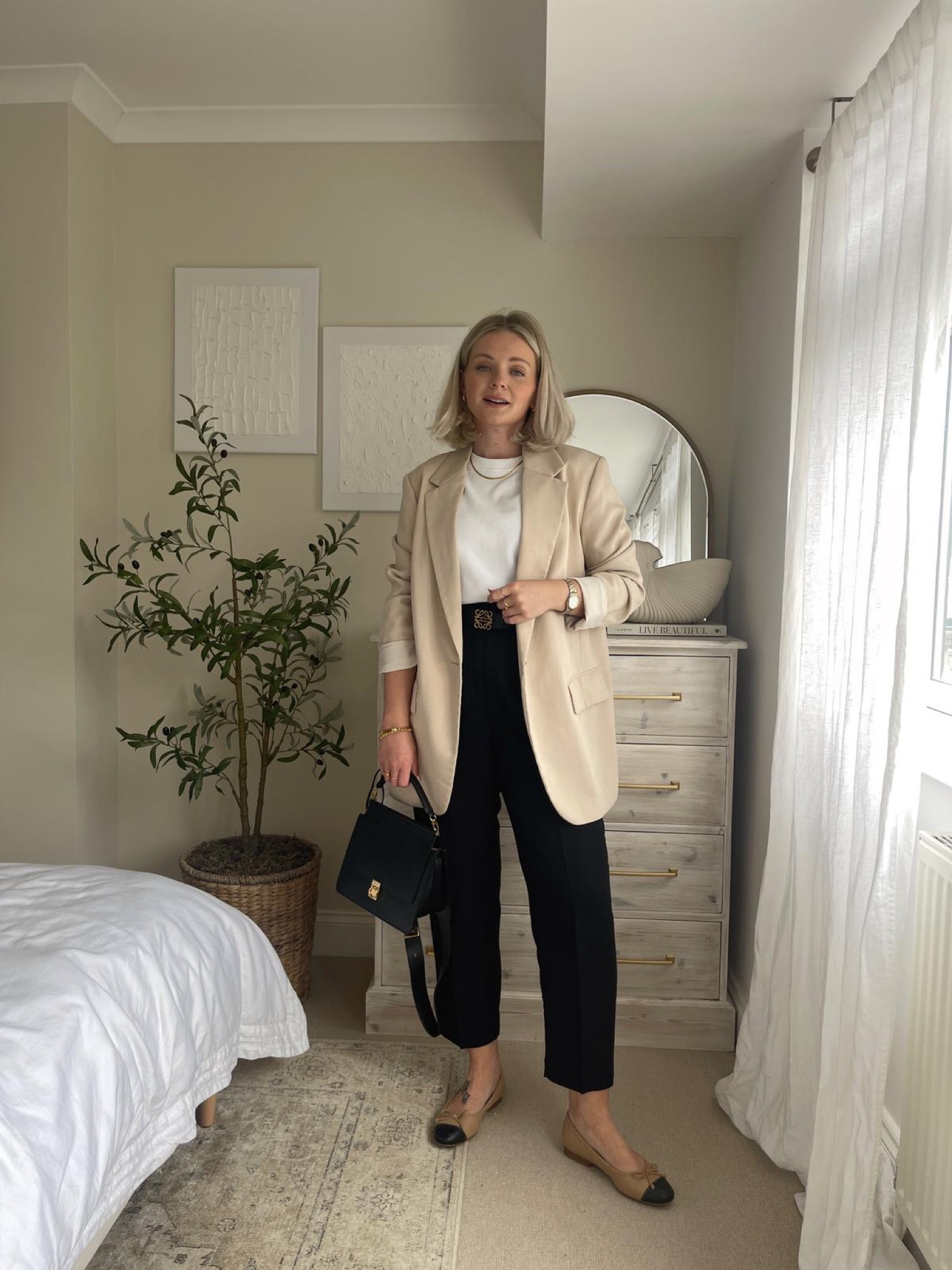 Neutral chic look for spring - cos white t-shirt, beige oversized blazer, H&M black linen trousers, Loewe anagram reversible belt, polene paris black top handle handbag & two tone ballet flats  

#LTKstyletip #LTKeurope #LTKSeasonal