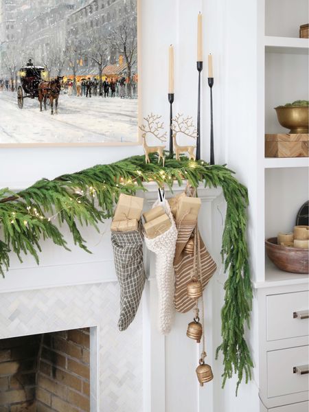 Christmas mantel decor, garland, bells, candle tapers, frame TV

#LTKHoliday #LTKhome #LTKstyletip