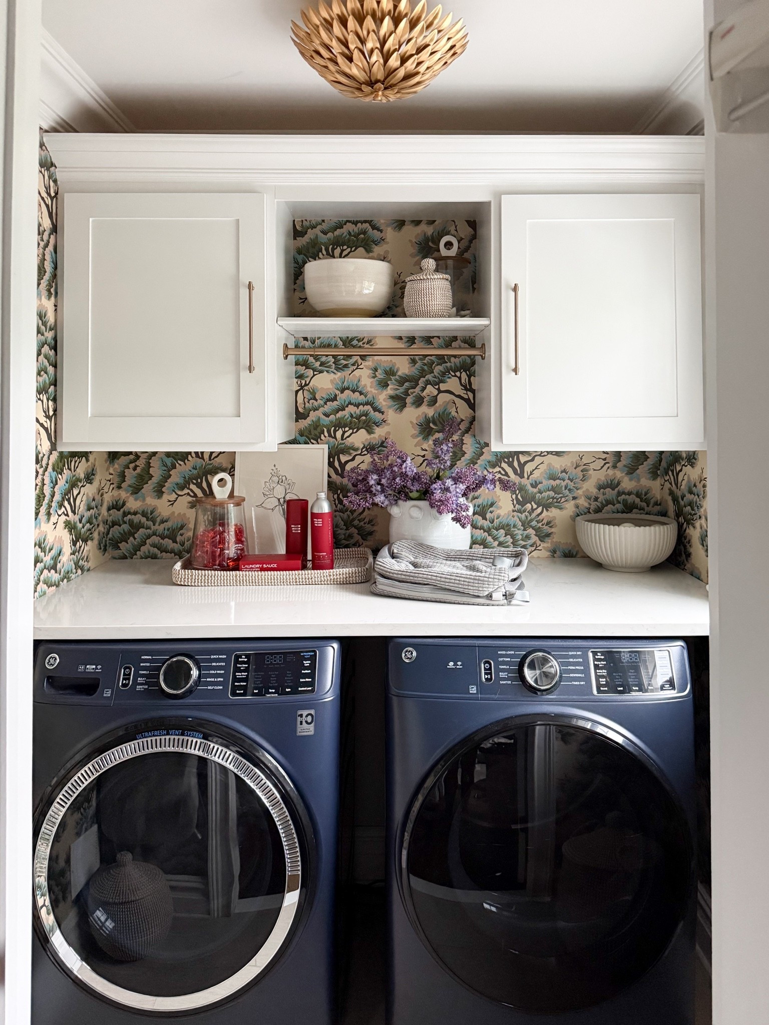 Who says a small laundry room can’t be beautiful? If anything, a smaller space gives you the freedom to go bold with wallpaper, lighting or color 🩶

#LTKHome #LTKmorningroutine #LTKmomlife
