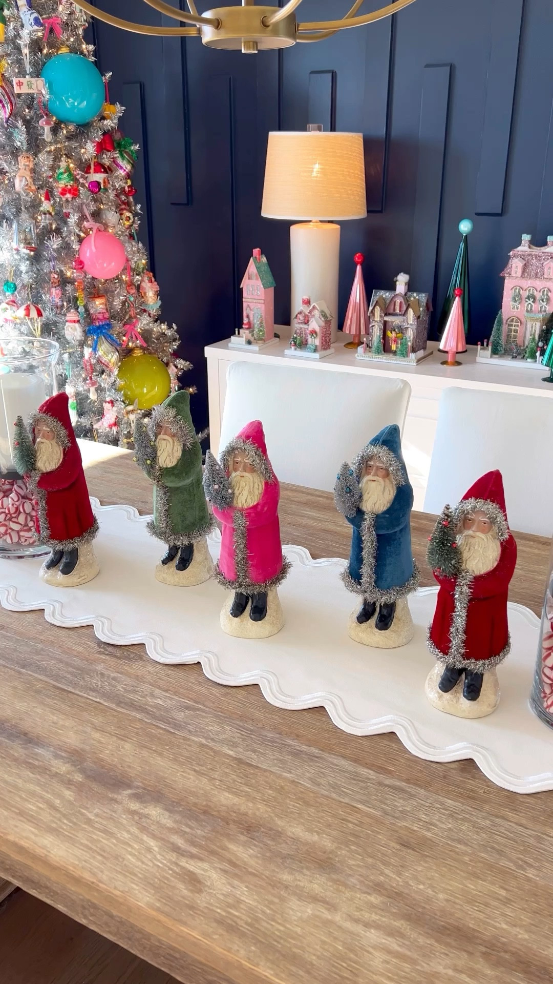 Whimsical Christmas decor, colorful Christmas decor, pink antlers Christmas decor, Cody foster Christmas house, Christmas village, Santa, vintage Christmas, Christmas ornaments, table runner, Christmas table

See my LTK page for more of these items linked! Can only link so many per post!🩷

Love how the dining room looks all dressed up for Christmas! These Christmas village houses are one of my favorite things to collect!❄️🎄🎀 and these vintage Santas all look SO cute together as a collection! This scalloped Anthro table runner is so pretty! Comes in lots of cute color combos, great year round! 

#LTKHoliday #LTKFindsUnder100 #LTKHome