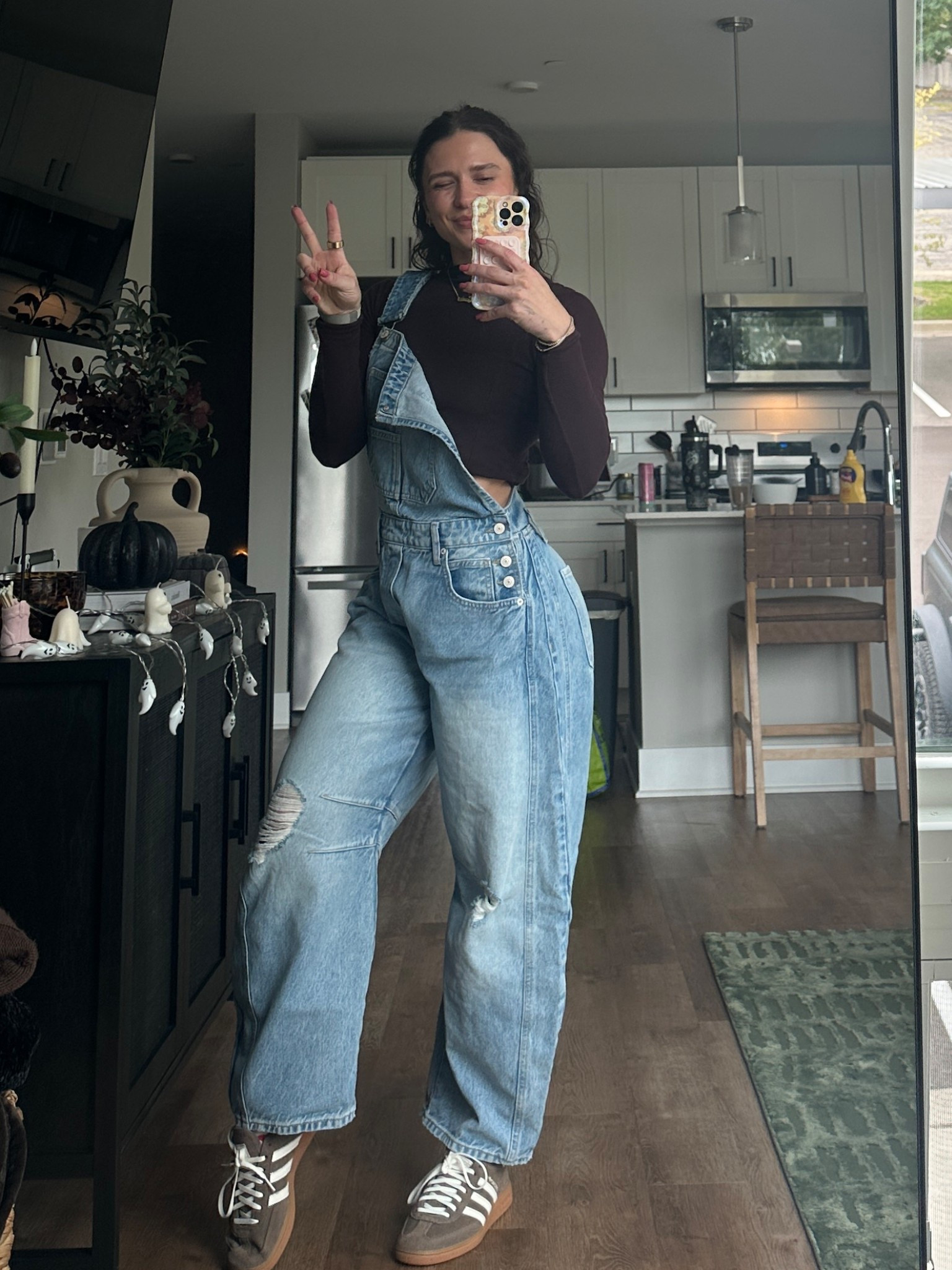 Love these overalls wearing size small! 