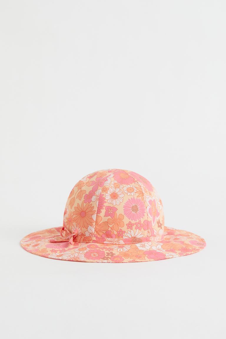 Sun hat in woven fabric with a wide, cotton-lined brim and a decorative, sewn bow. Width of brim ... | H&M (US + CA)