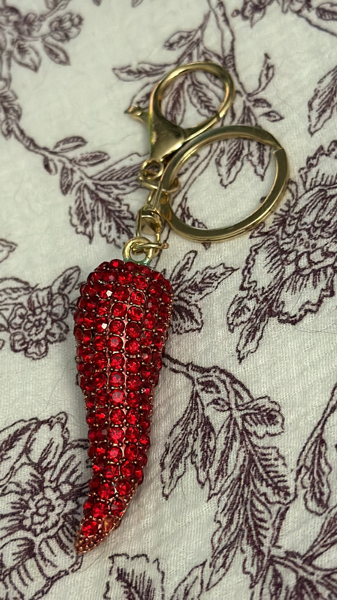 It’s the little accessories that make me the happiest. ❤️🌶️ I originally bought this rhinestone chili pepper keychain to upgrade my car keys, but I’ve already started using it as a bag charm too, and honestly… I’m obsessed. The sparkle catches the light perfectly, and it adds so much personality whether it’s clipped onto my keys, handbag, tote, beach bag, or travel bag.

If you love fun accessories that make your everyday essentials feel a little more unique, this is such a cute find. It’s lightweight, eye-catching, and the perfect way to add a pop of color without spending a fortune. Safe to say my chili pepper obsession is only getting worse, and I’m completely okay with that. 😂✨

#LTKHome #LTKstorytime #LTKSaleAlert