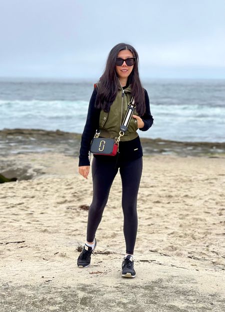 A casual black base with my puffer hoodie vest for a gloomy morning at the beach 🌊 This is one of my travel outfits from last summer: a simple hoodie and leggings combo!

#LTKtravel #LTKFind #LTKfit