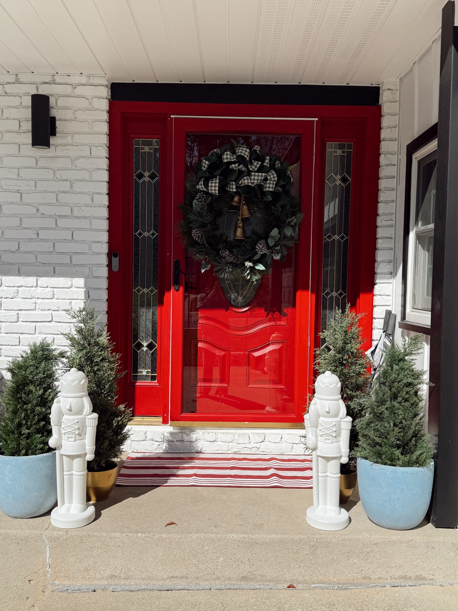 Front door christmas decor 
Pine trees
Nutcracker 

#LTKHome #LTKSeasonal