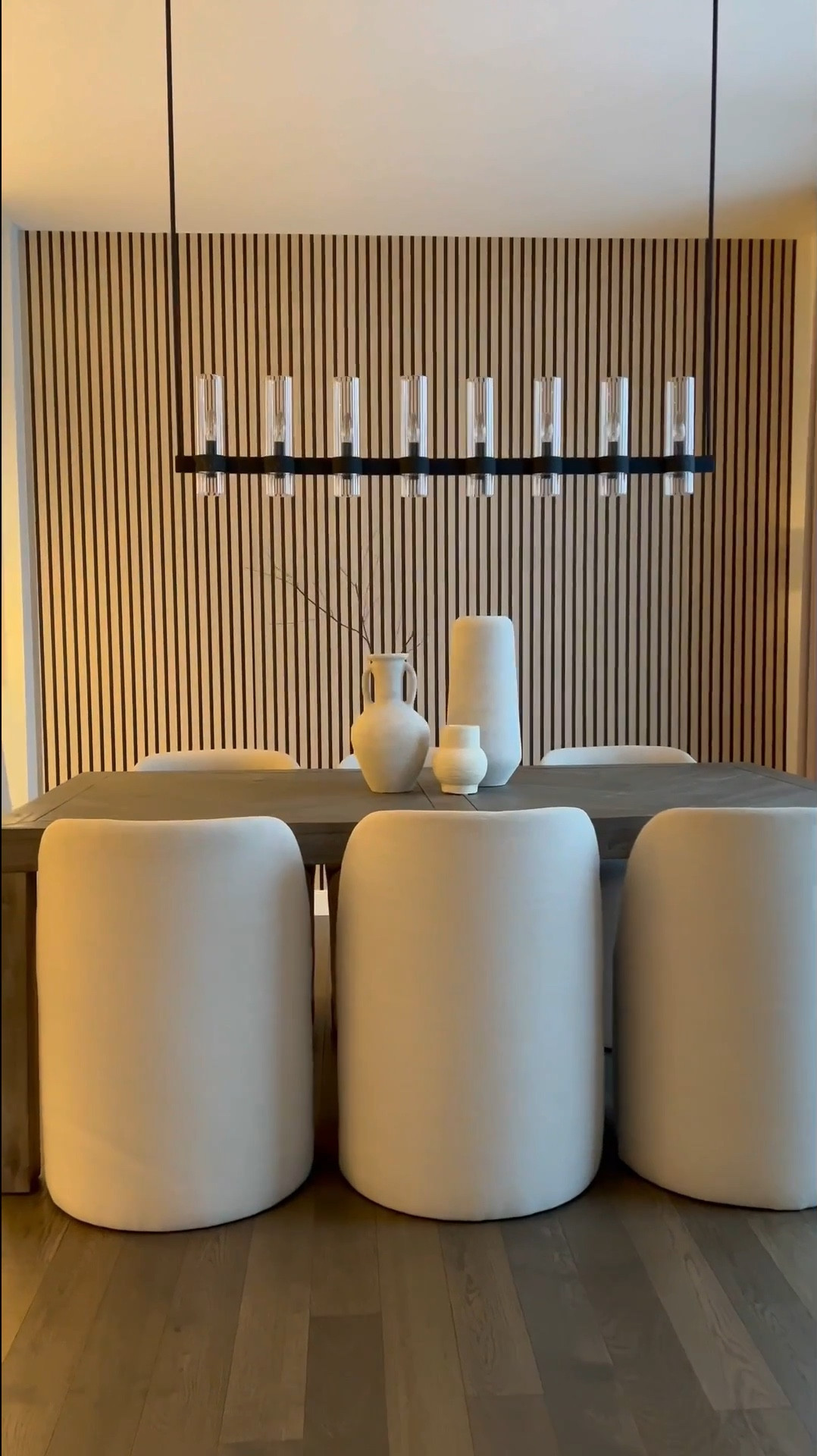 (I used color Wood A)

 Hey friend! ☺️

So here’s a simple way to upgrade your wall and get the wooden slat look with wallpaper! 🎉

Tips: 
Wallpaper is peel and stick so to remove, use a blow dryer so you don’t mess up your paint or drywall ☺️ I used 3 rolls. My wall is 9ft by 10.5ft 

This is by far the simplest wallpaper I’ve installed. The design is forgiving, so even if you overlap a bit more than you’d like, it isn’t noticeable… making install even simpler. 

I added plug in 16 ft LED light strips to the back of the mirror. Color is warm white or 3000K. 🔌 My mirror is 83inches in height by 48 inches. 🪞 

The sconces are my favorite addition to this wall! They are rechargeable. 🎉 They attach to the wall in two ways - They come with screws & a peel and stick adhesive….. which attaches to a magnetic metal piece which makes the sconce removable without having to reinstall it. 💕

I’ve linked the rest of the items below! ☺️
#LTKStyleTip 

#LTKSaleAlert #LTKHome