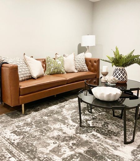 If mixing black and brown in the same space is wrong, then we don’t want to be right!
.
.
.
Leather Sofa
Nesting Coffee Table
Black Coffee Table
White Bowl
Cream Candle Holders
Faux Fern
Geometric Vase
Eclectic Design 
Black & Brown

#LTKstyletip #LTKhome #LTKbeauty