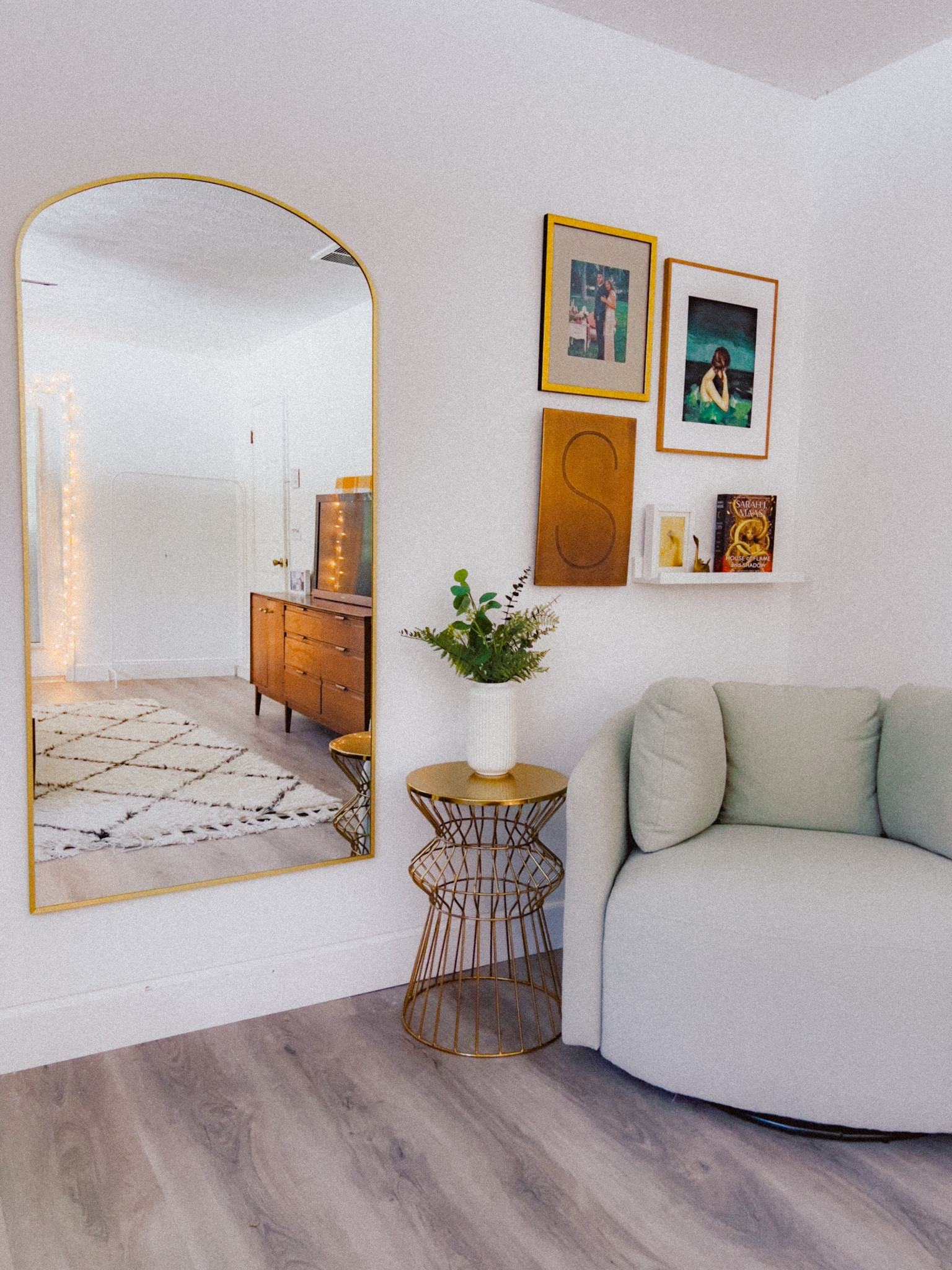 Added a mirror to my reading nook area! 🥰 
••
oversized reading chair | brass arch mirror | small gallery wall | gold & green

#LTKhome