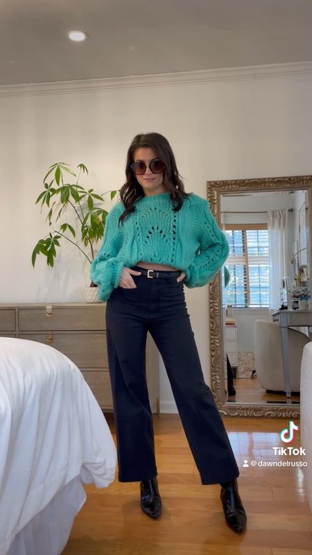 Simple styling with a teal chunky sweater and wide leg pants 