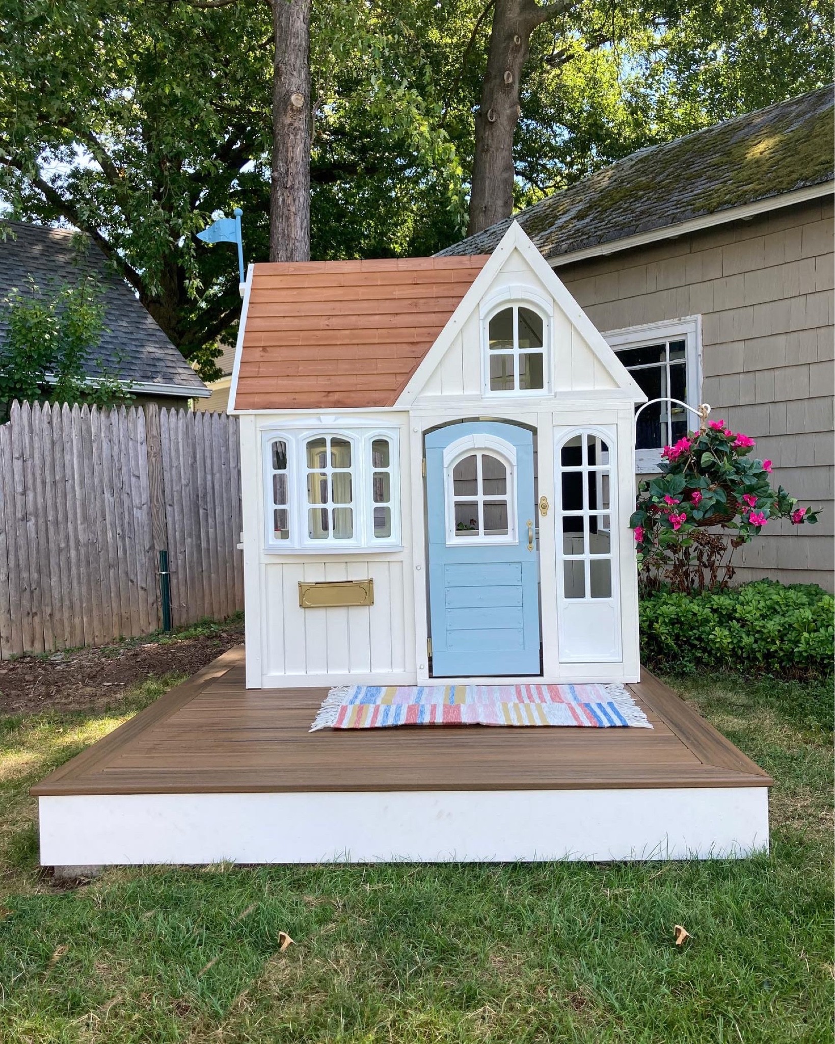 Playhouse. Playhouse makeover. Cedar house. Blue door. Kid Kraft. 

#LTKbaby #LTKkids #LTKhome