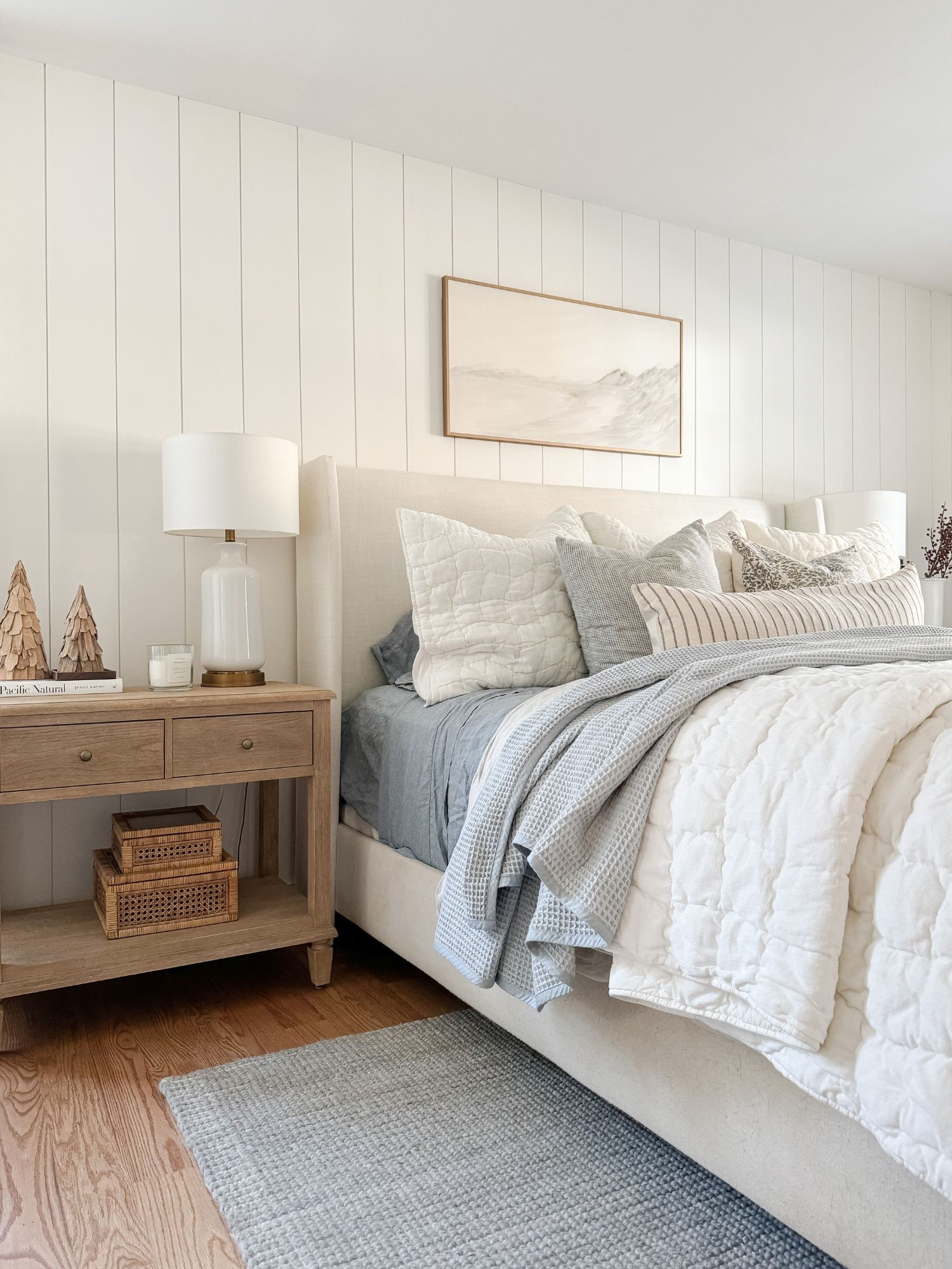 A soft coastal winter bedroom nightstand layered with clean ceramics, stacked books, and simple winter trees. This bedside setup adds just enough winter interest while keeping things calm and refined. Winter bedroom, coastal nightstand styling, neutral bedside decor, coastal winter bedroom, ceramic lamp, winter nightstand decor, minimal bedroom styling, serene coastal bedroom, layered nightstand, soft winter accents, Sherri Calnan Home

#LTKSeasonal #LTKHome