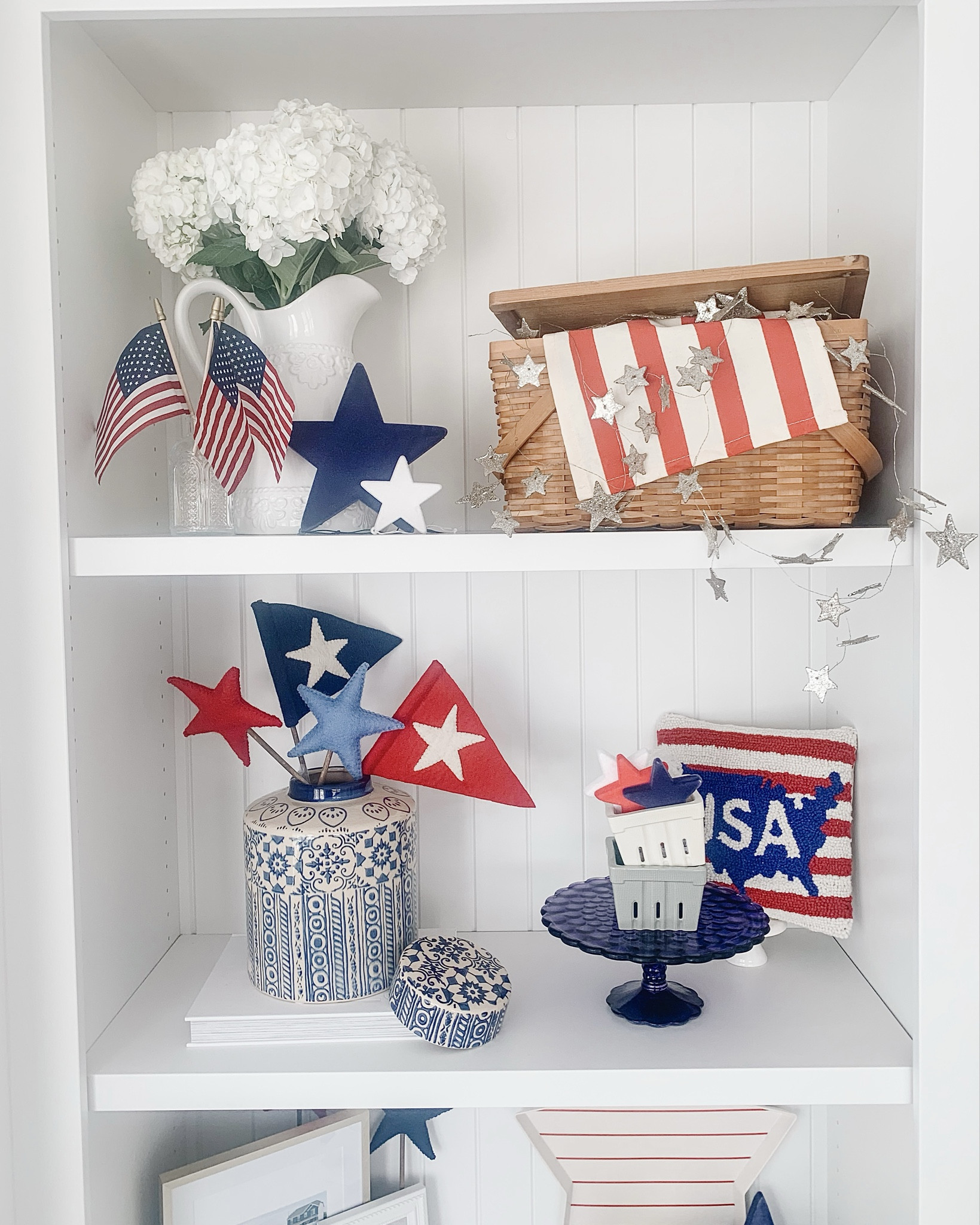 One of my favorite ways to decorate for the 4th of July 🇺🇸 Shelves are perfect for layering flags, stars, vintage finds & festive little touches! Linked some similar pieces to help you create your own star-spangled style ✨

#shelfie #4thofjulydecor #LTKhome #patrioticdecor 

#LTKSummerEdit 

#LTKStyleTip #LTKSeasonal