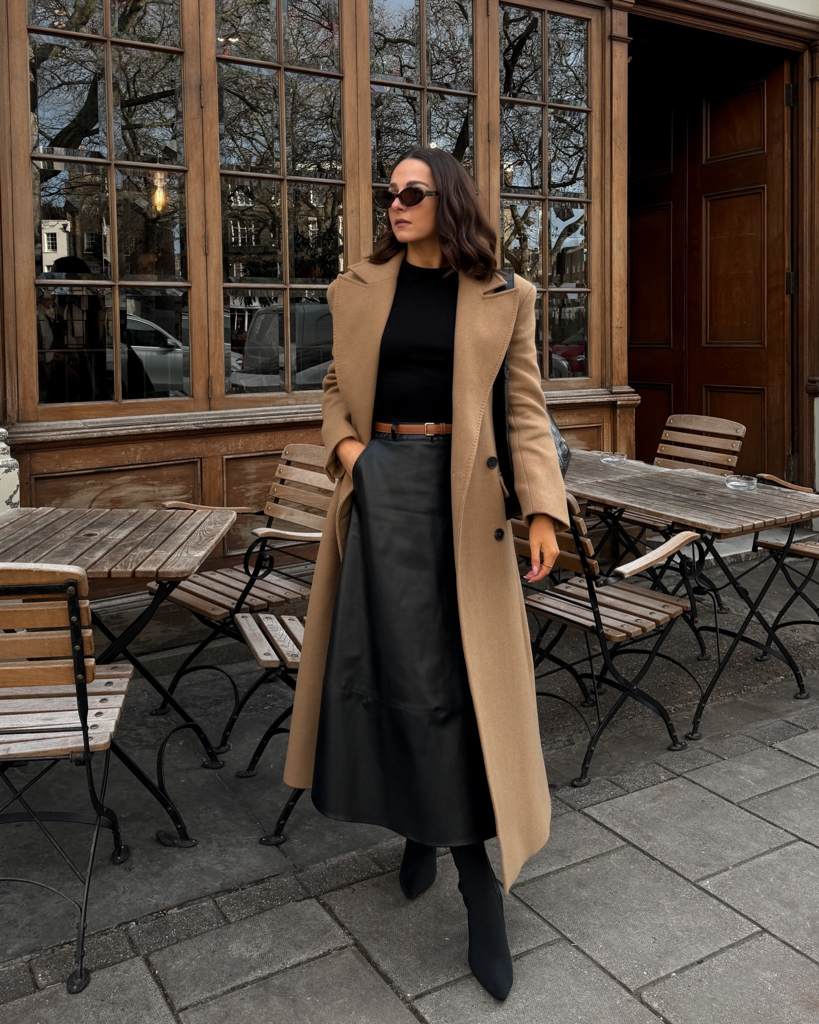 Autumn winter outfit, longline coat, camel coat, long coat, faux leather skirt, midi skirt, brown and black outfit, Karen Millen, River Island, Marks and Spencer, brown coat, black skirt, black boots ✨ 

#LTKstyletip #LTKeurope #LTKfindsunder100
