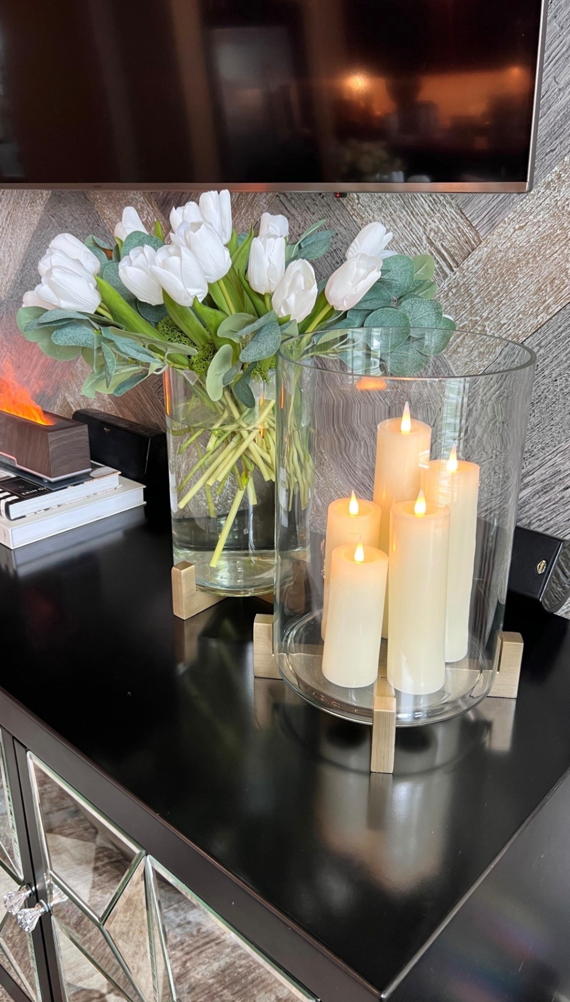 Faux candles and flowers are my favorite way to keep my house feeling lux all the time! This is what I have under my TV on the center console.

#LTKHome