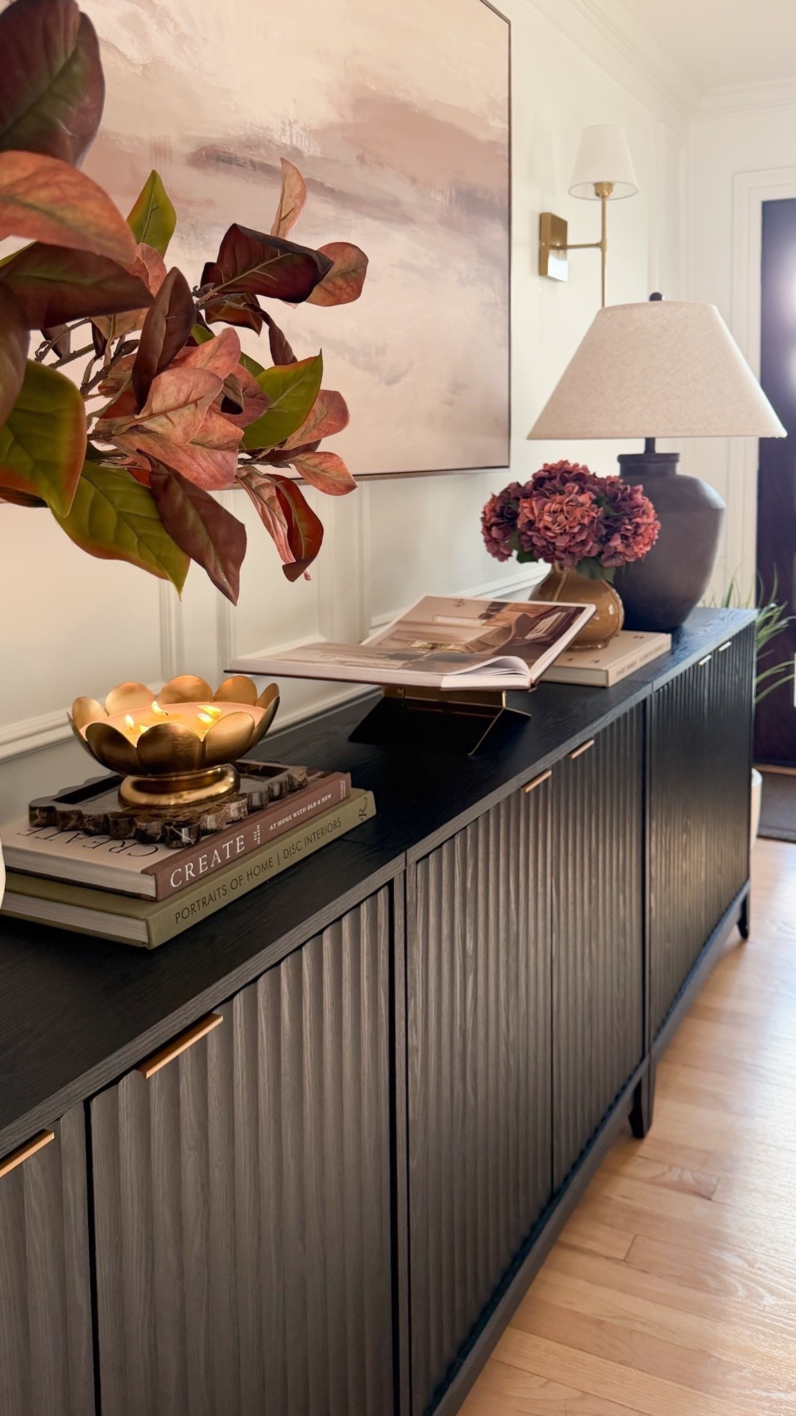 Fall entryway details are all in the little things. 🤎🍂

From the wireless sconces and oversized table lamp to the warm fall stems, pretty vases, candleholder, books, and bookstand, each piece adds another layer of warmth and character to the space. ✨

I love how these simple touches make the entryway feel cozy, collected, and ready for fall without going overboard.

#LTKHome #LTKSeasonal #AmazonHome #FallDecor #LTKSaleAlert

#LTKHome #LTKSeasonal #LTKmomlife
