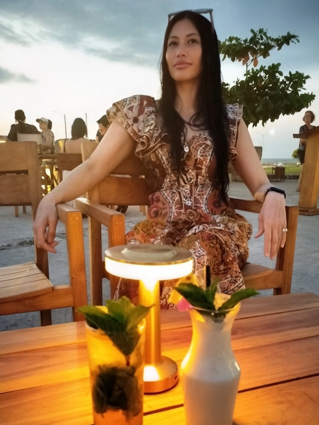 Because we started the day a little late, we missed most of our Old City walking tour — but Cartagena had better plans for us.

We made it to El Baluarte just barely before sunset and it ended up being the most magical introduction to the city. A cabana bar perched on top of the historic walls, live music drifting through the air, ocean views on one side and the glowing Old City on the other… pure Cartagena romance.

Cocktails in hand, warm breeze, and then fireworks lighting up the sky right above us. We’re choosing to believe they were staged as our official welcome. Let me be delusional in peace.

Wearing my colorful FarmRio dress that feels made for Caribbean sunsets, and Marcelo looking effortlessly handsome in his UNTuckit shirt — the kind of night you wish you could bottle forever.

Cartagena, you already have my heart.