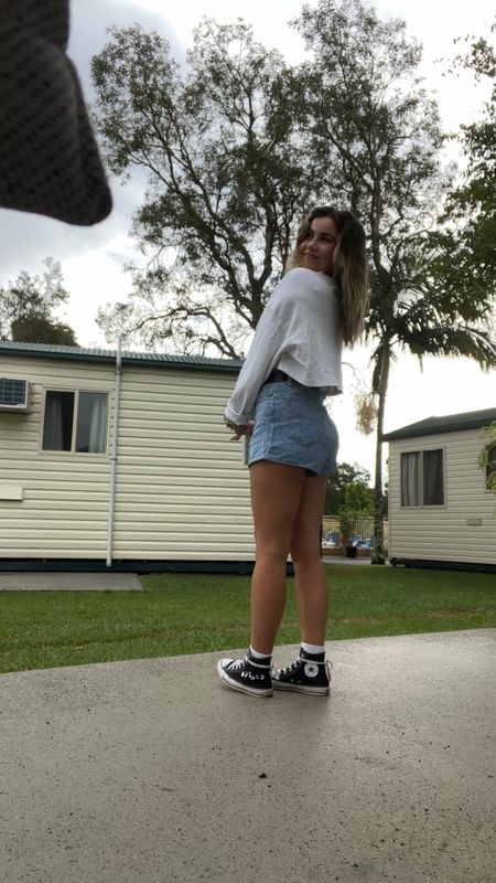 High waisted Levi denim shorts with hi too black converse and an oversized white tee for todays travel outfit 

#LTKstyletip #LTKaustralia #LTKunder50