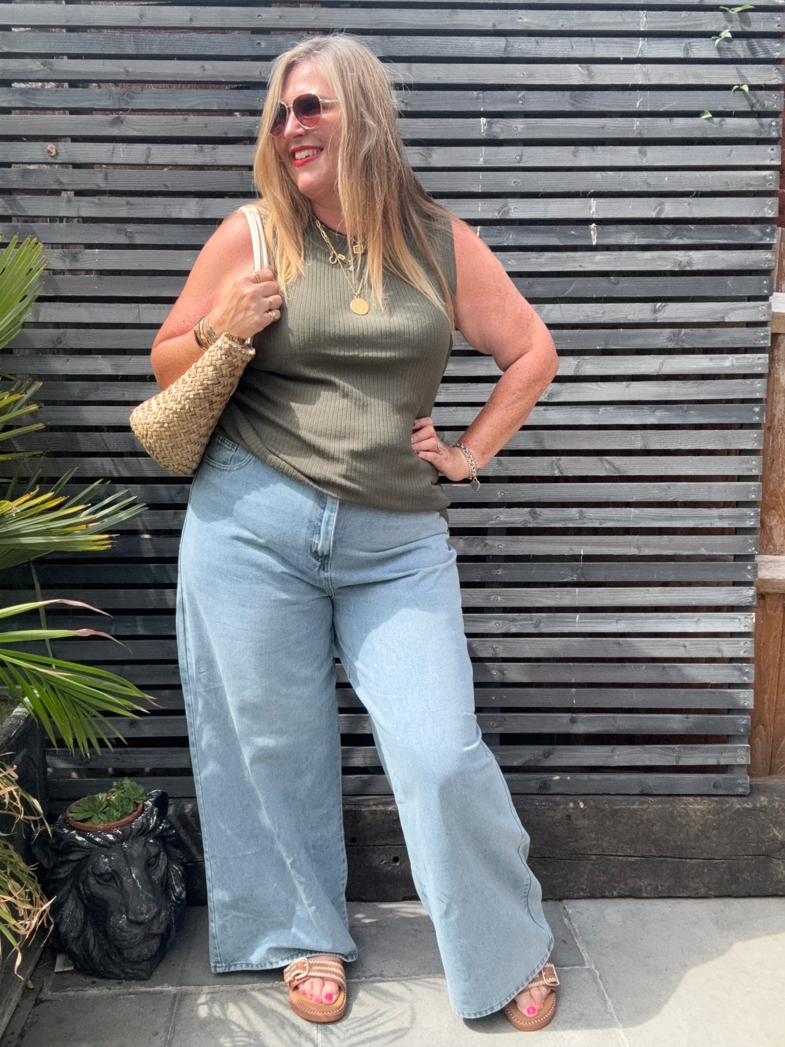 Wide leg Palazzo jeans , khaki top, sandals, sunglasses 

#LTKsummer #LTKplussize #LTKcurves