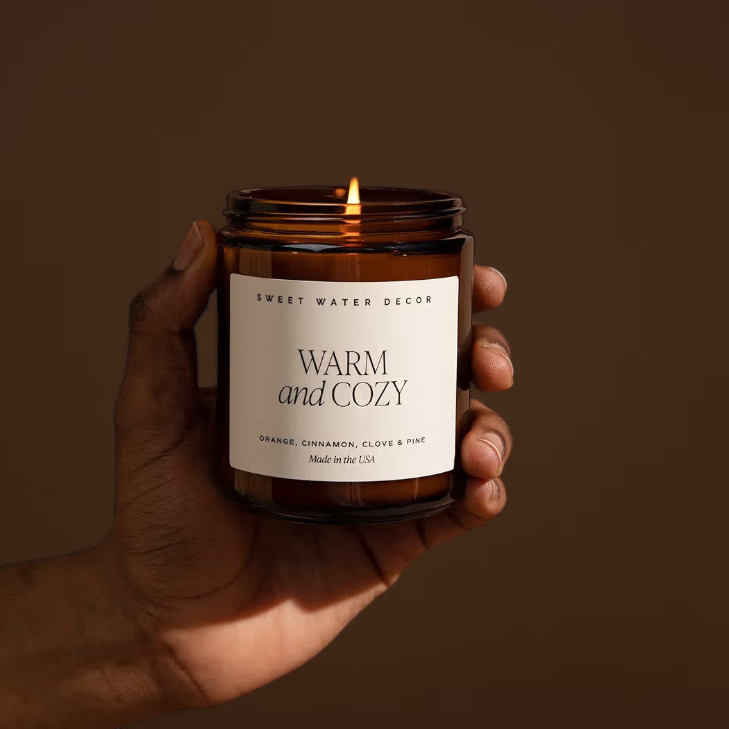 Sweet Water Decor Warm and Cozy Soy Candle - Orange Peel, Cinnamon, Ginger and Clove Scented Candles for Home - 9oz Amber Jar + Black Lid, 40+ Hour Burn Time, Made in The USA | Amazon (US)
